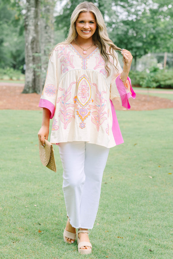Plus Size cream tunic top with pink and yellow embroidery, V-neckline, and wide bell sleeves.