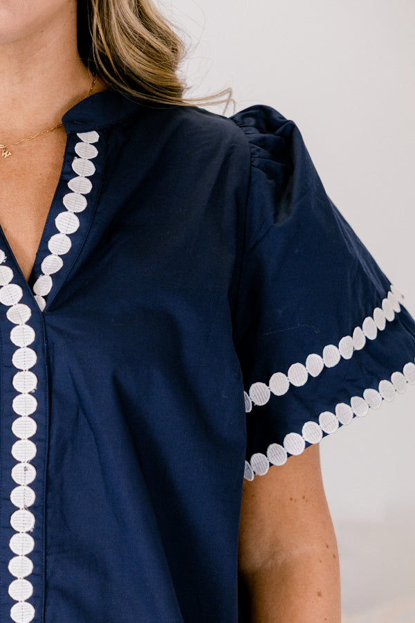 Chic Soul plus size clothing, navy bell sleeve v neck top with white dot trim around the neckline, midline, and sleeve