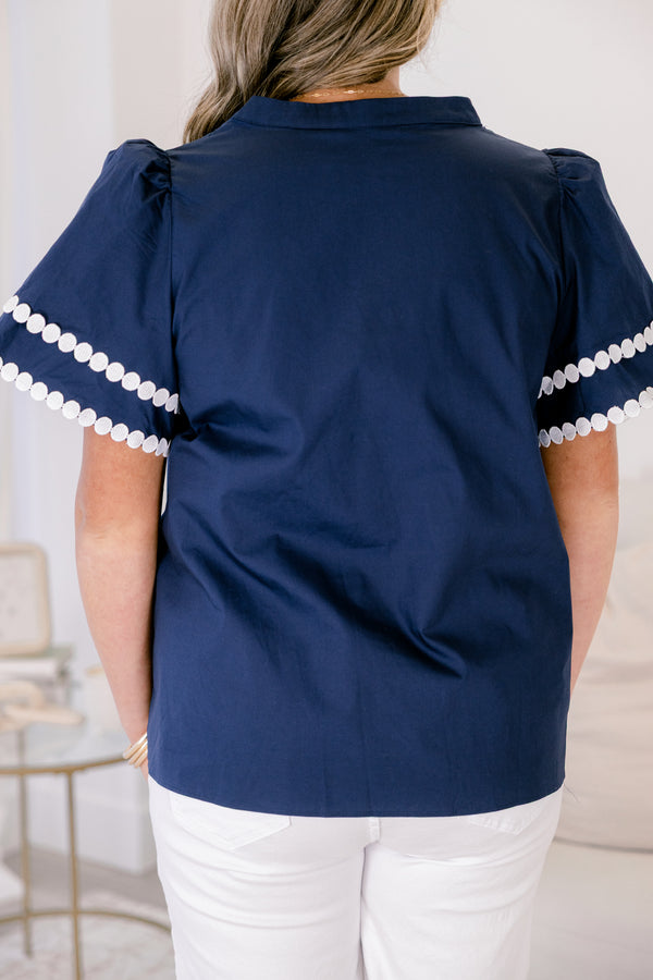 Chic Soul plus size clothing, navy bell sleeve v neck top with white dot trim around the neckline, midline, and sleeve