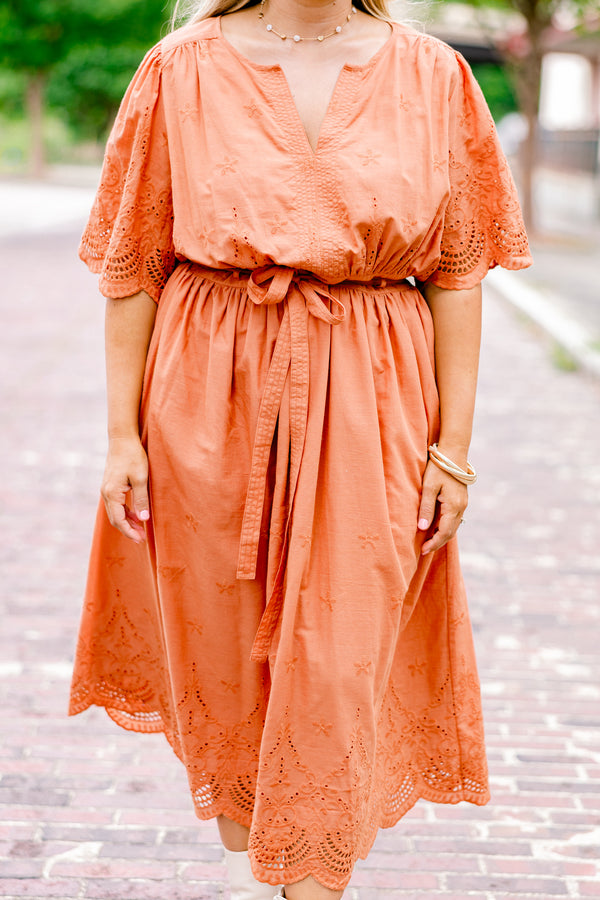 Chic Soul plus size clothing, orange short sleeve midi dress with v-neck and tie belt at the waist and embroidered detailing on the sleeves, top, and hem of the dress