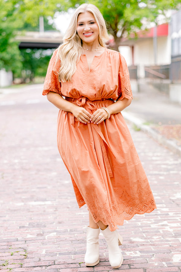 Chic Soul plus size clothing, orange short sleeve midi dress with v-neck and tie belt at the waist and embroidered detailing on the sleeves, top, and hem of the dress
