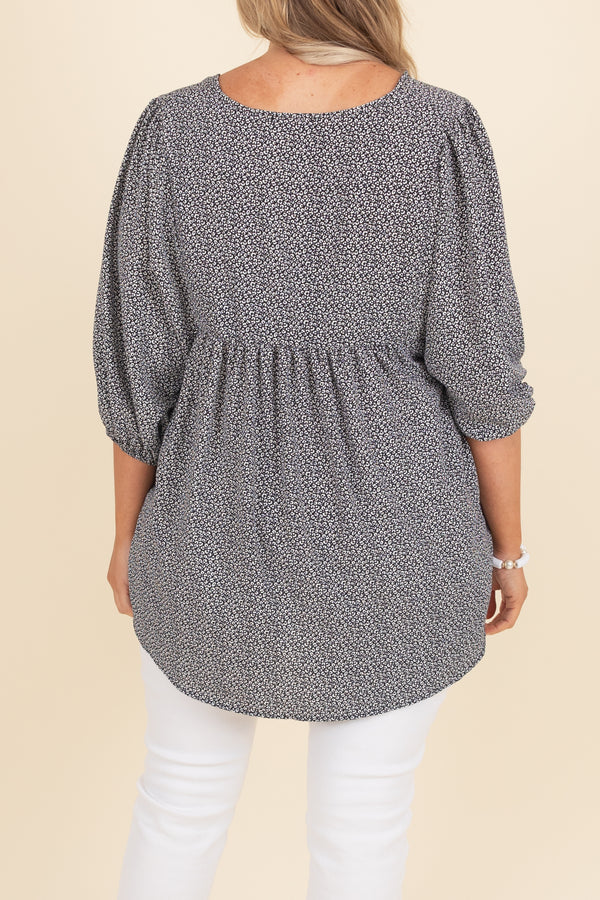 Chic Soul plus size clothing, black top with white pattern and bubble sleeves