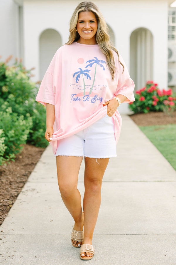 Plus Size dusty pink oversized boyfriend tee with a palm tree graphic and white denim shorts.