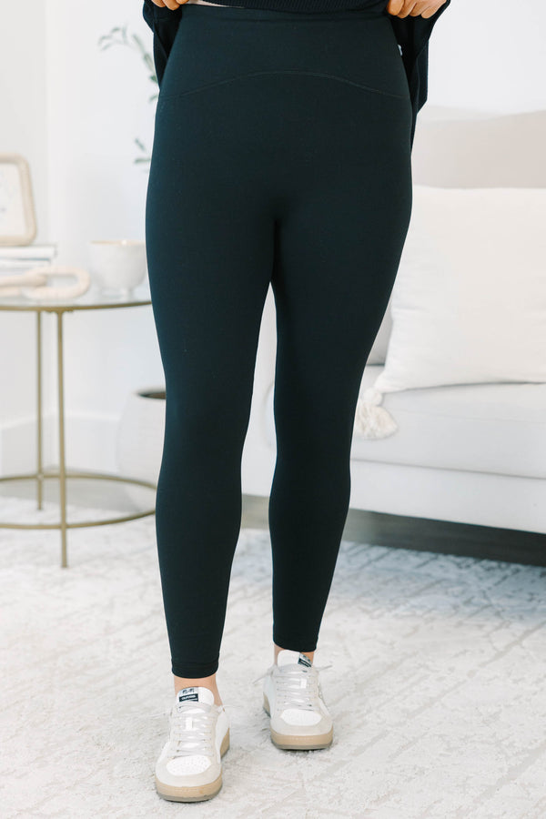 Plus size high-rise black seamless leggings with a stretchy, buttery soft nylon fabric.