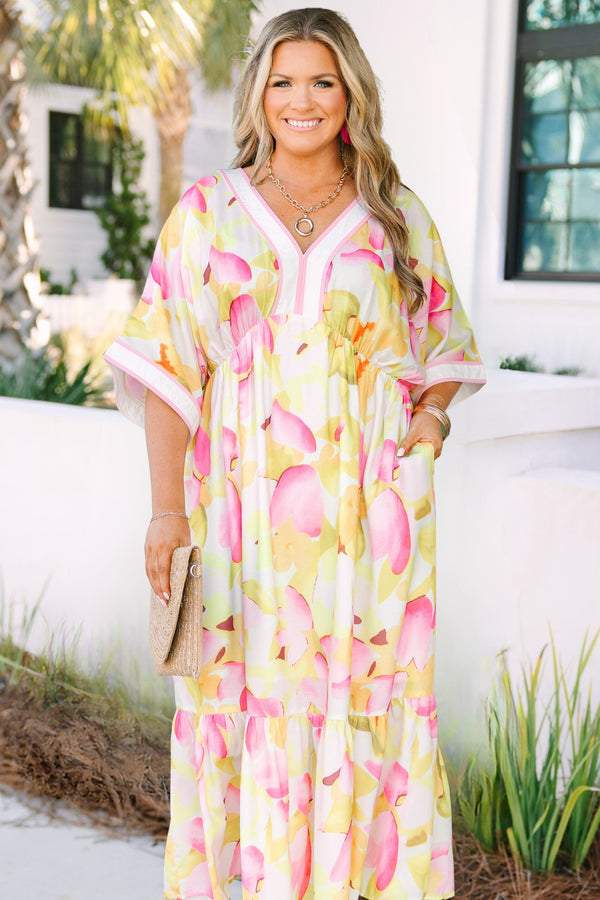 Chic Soul plus size clothing, white maxi dress with half sleeves and a yellow and fuchsia floral pattern throughout as well as pink outlining the v-neckline and end of the sleeves 