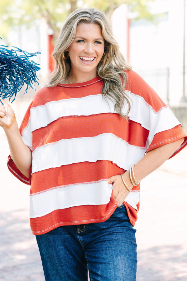 Plus Size rust and white striped French terry top with exposed seams and a relaxed fit.