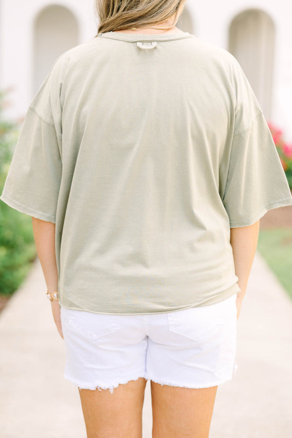 Plus Size army green vintage wash tee with white USA star graphic and white frayed denim shorts.