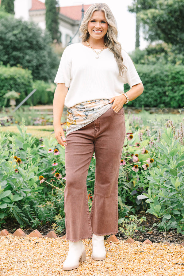 Plus Size high-waisted boot cut jeans in rum brown with a frayed hem and acid-wash finish.