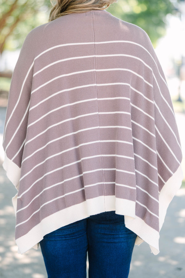 Plus Size brown and white striped knit poncho with a mock neckline and wide sleeves.