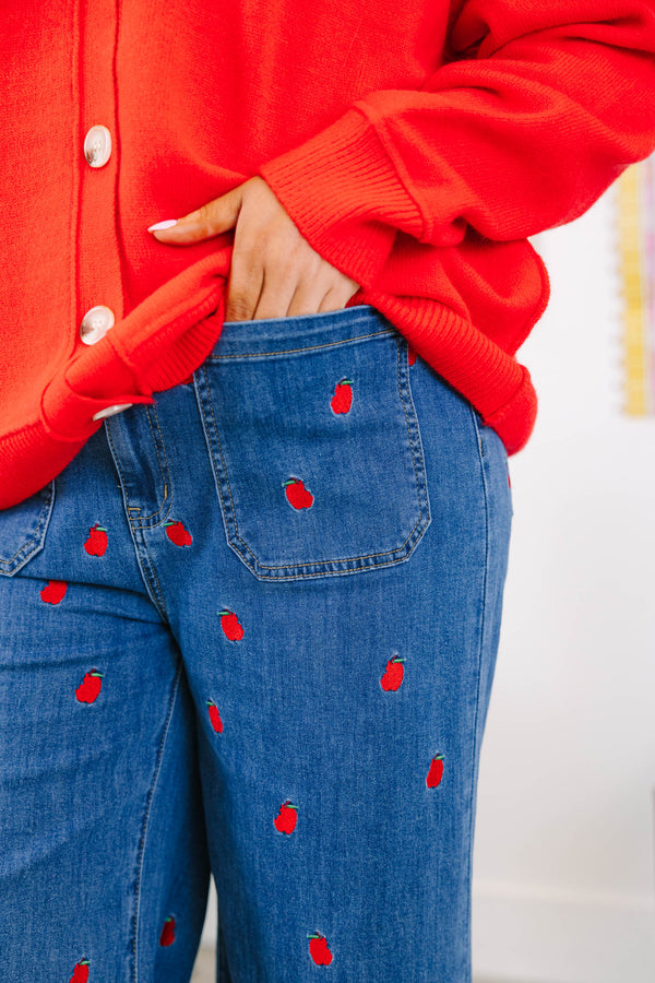 Plus Size cropped wide leg blue denim jeans with red bitten apple embroidery and frayed hem.