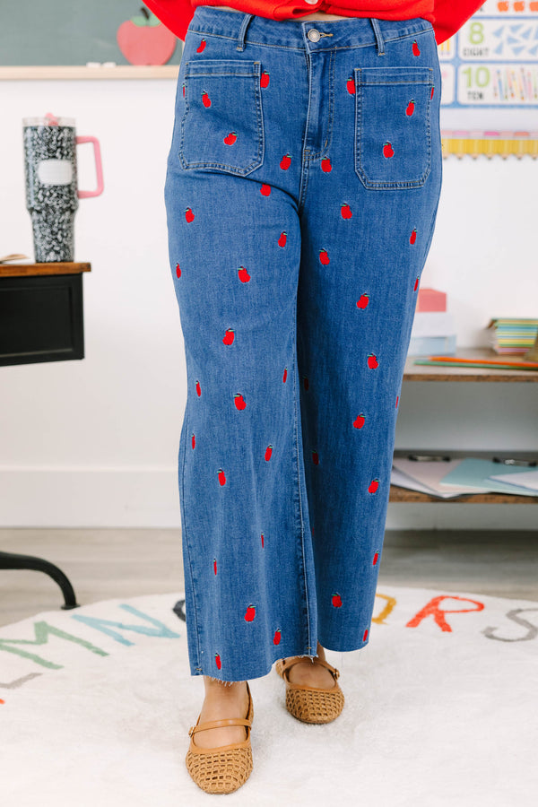 Plus Size cropped wide leg blue denim jeans with red bitten apple embroidery and frayed hem.