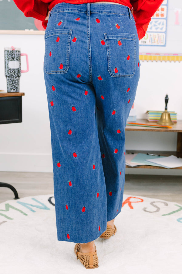 Plus Size cropped wide leg blue denim jeans with red bitten apple embroidery and frayed hem.