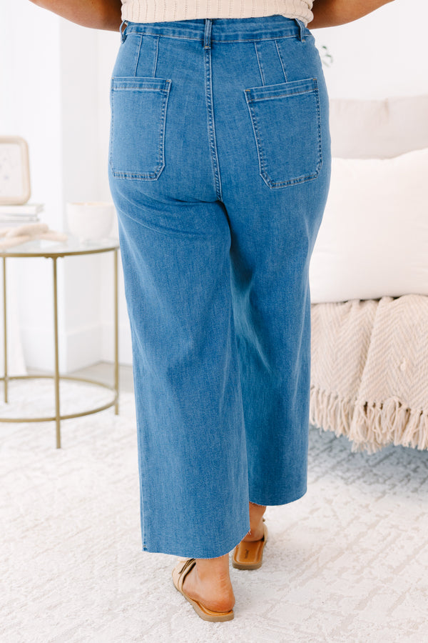 Plus Size wide-leg blue jeans with front patch pockets featuring white bow embroidery.