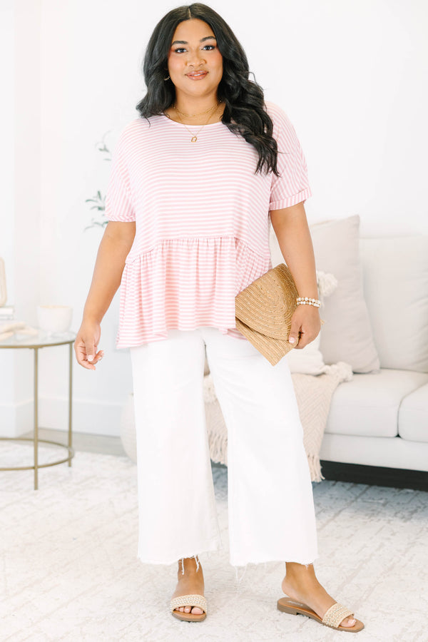 Plus size pink and white striped, flowy babydoll top with short sleeves.