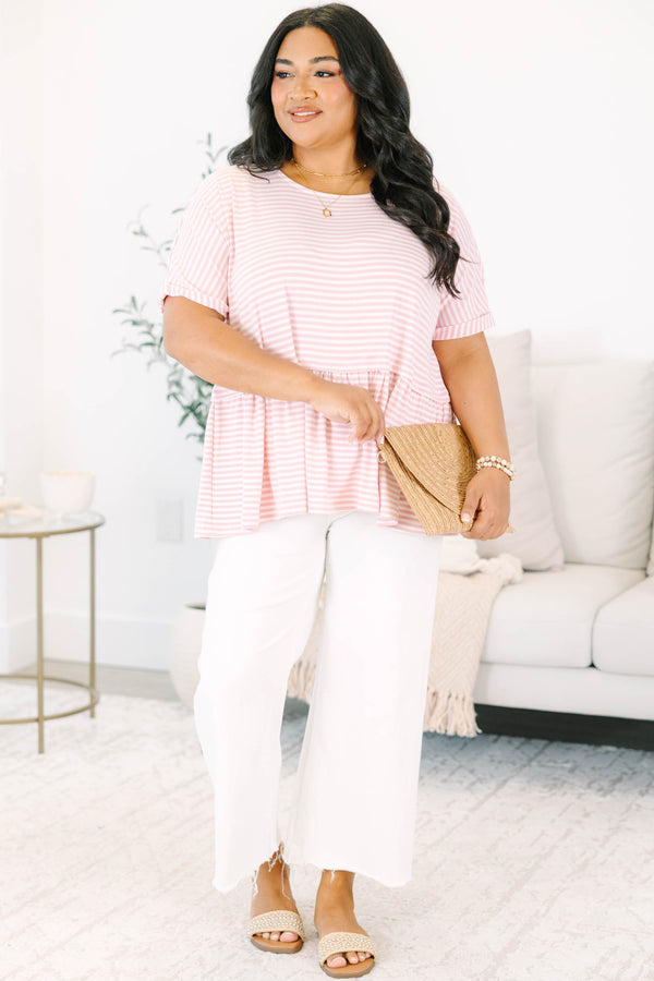 Plus size pink and white striped, flowy babydoll top with short sleeves.