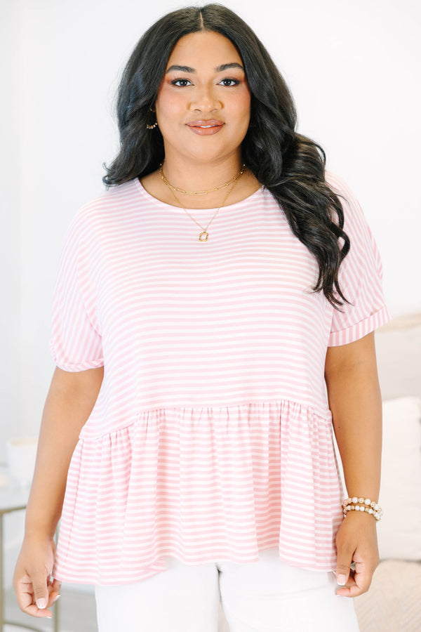 Plus size pink and white striped, flowy babydoll top with short sleeves.