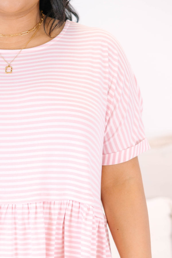 Plus size pink and white striped, flowy babydoll top with short sleeves.