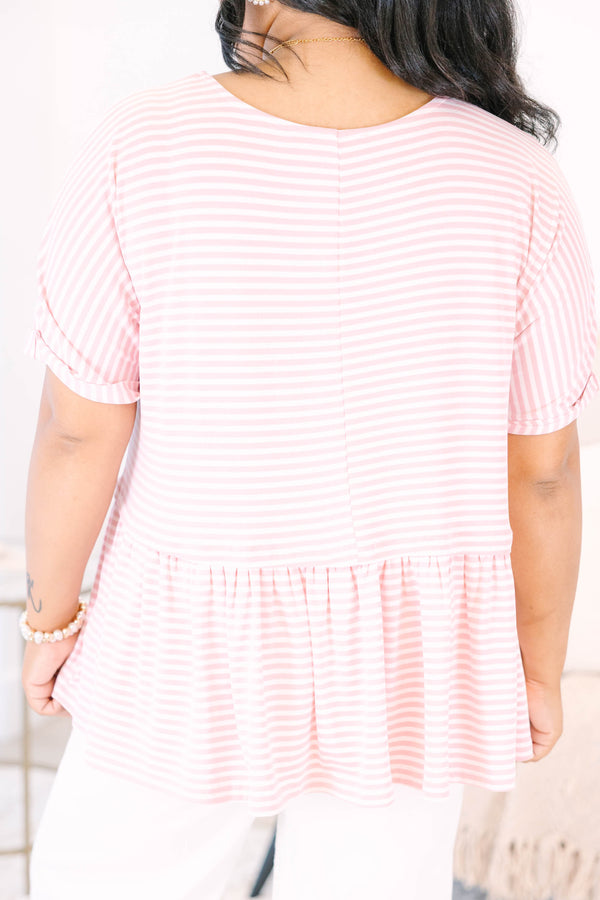 Plus size pink and white striped, flowy babydoll top with short sleeves.