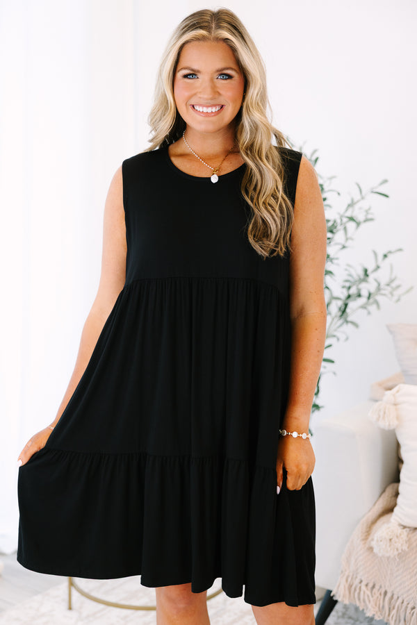 Plus Size sleeveless black babydoll dress with a tiered skirt and round neckline.