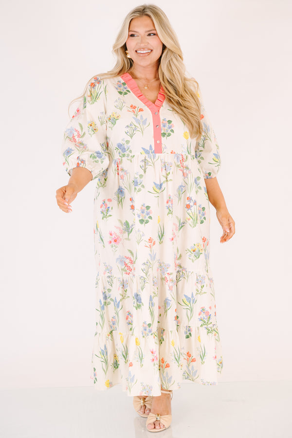 Chic Soul plus size clothing, cream maxi dress with half bubble sleeves along with a pink strip ruffle detail going along the v-neckline and a multi-colored floral pattern throughout