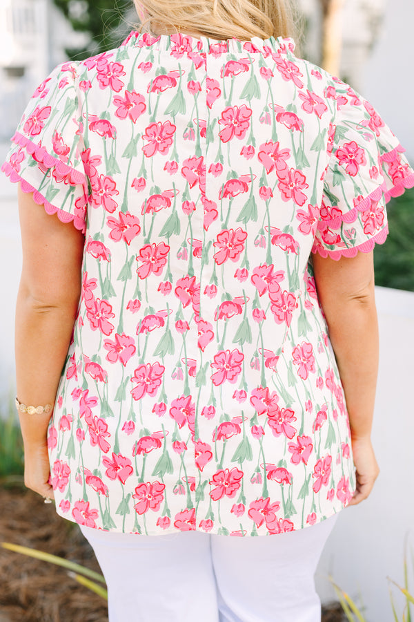Chic Soul plus size clothing, pink top with flutter sleeves that have a pink scalloped detail along each ruffle and scalloped detailing along the v-neckline as well as a floral pattern throughout 