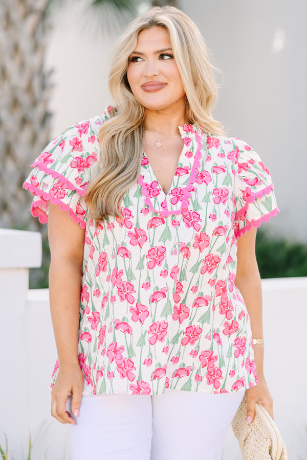 Chic Soul plus size clothing, pink top with flutter sleeves that have a pink scalloped detail along each ruffle and scalloped detailing along the v-neckline as well as a floral pattern throughout 