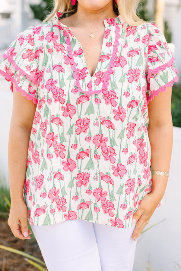 Chic Soul plus size clothing, pink top with flutter sleeves that have a pink scalloped detail along each ruffle and scalloped detailing along the v-neckline as well as a floral pattern throughout 