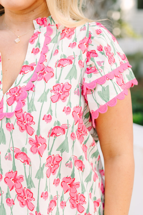 Chic Soul plus size clothing, pink top with flutter sleeves that have a pink scalloped detail along each ruffle and scalloped detailing along the v-neckline as well as a floral pattern throughout 