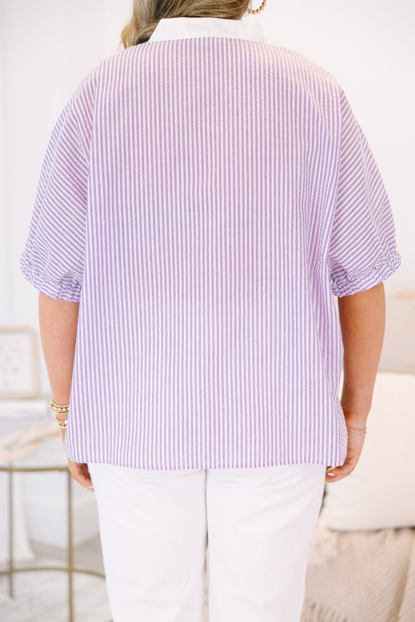 Plus Size lavender and white vertical striped top with a white V-neckline and short puff sleeves.