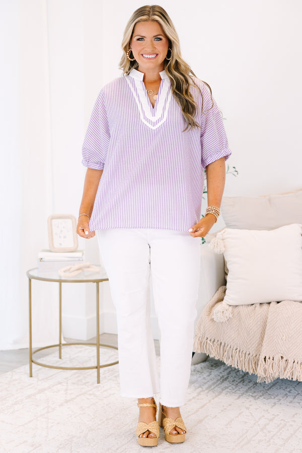 Plus Size lavender and white vertical striped top with a white V-neckline and short puff sleeves.