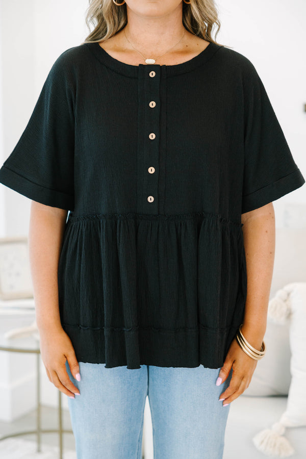 Plus size black cotton-blend babydoll top with button-front detail and a flowy tiered silhouette.