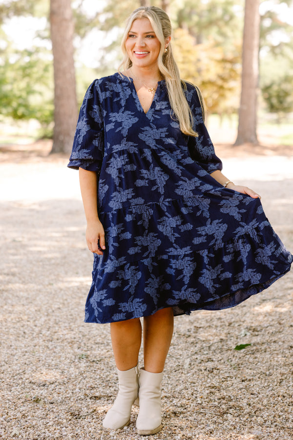 Chic Soul plus size clothing, navy blue short sleeve tiered knee length dress with v neckline and lighter blue floral print 