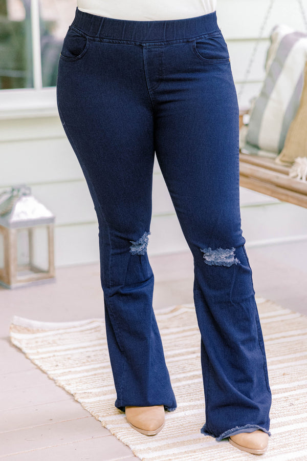 Chic Soul plus size clothing, dark wash full length bootcut denim jeggings with a distressed hem and distressing on the knees