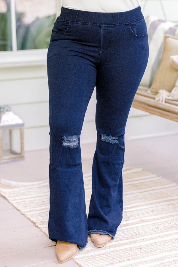 Chic Soul plus size clothing, dark wash full length bootcut denim jeggings with a distressed hem and distressing on the knees