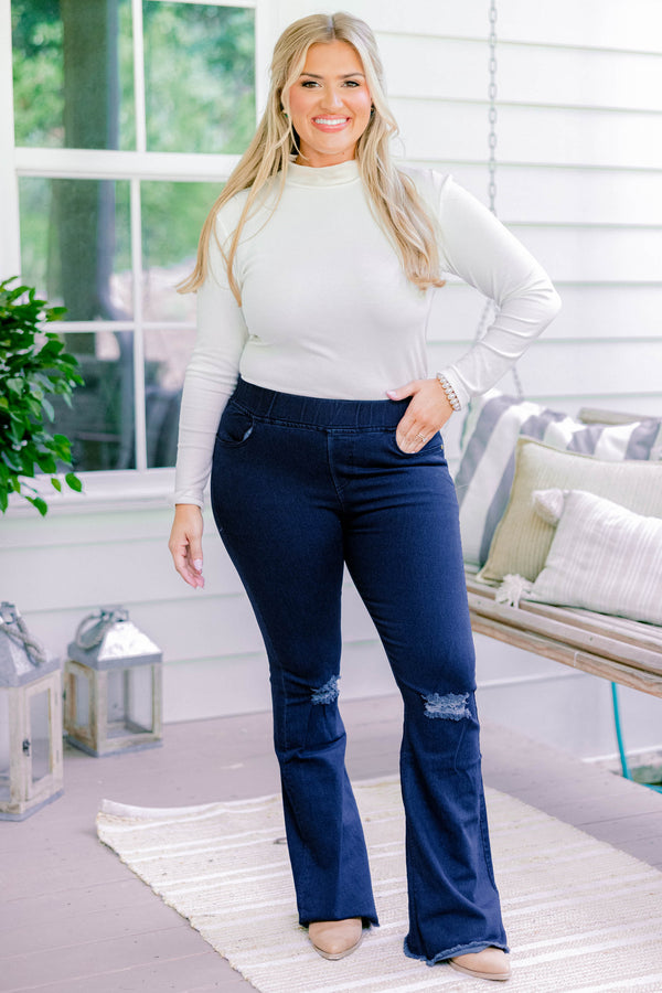 Chic Soul plus size clothing, dark wash full length bootcut denim jeggings with a distressed hem and distressing on the knees