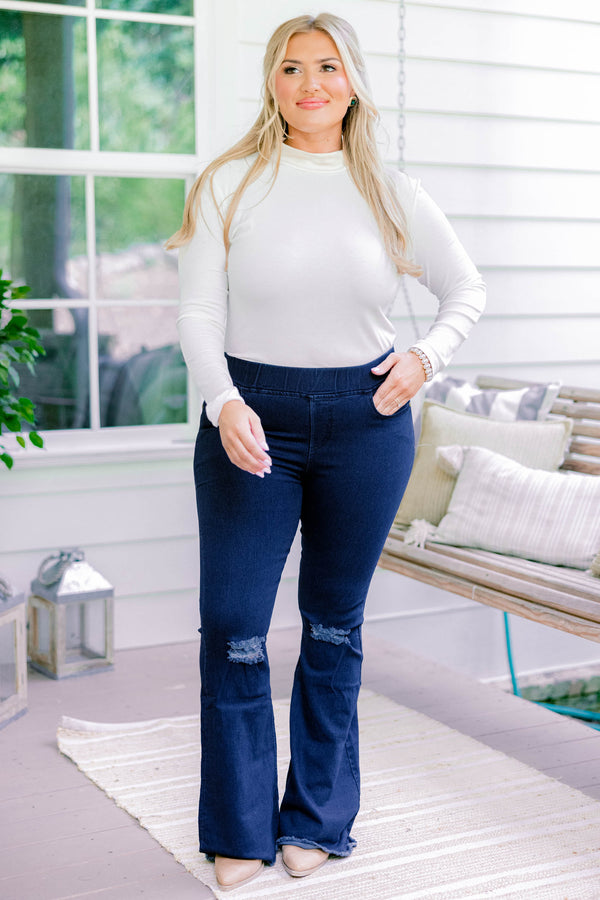 Chic Soul plus size clothing, dark wash full length bootcut denim jeggings with a distressed hem and distressing on the knees