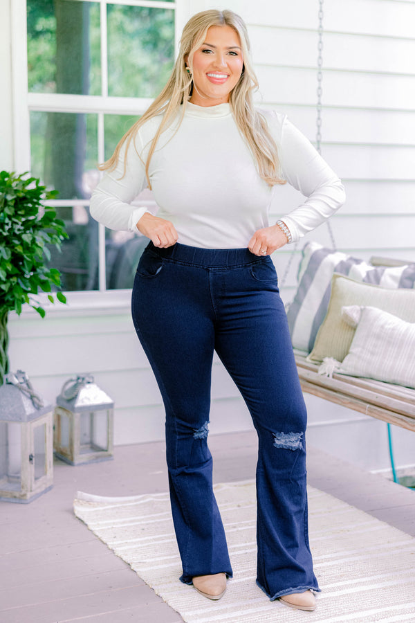 Chic Soul plus size clothing, dark wash full length bootcut denim jeggings with a distressed hem and distressing on the knees