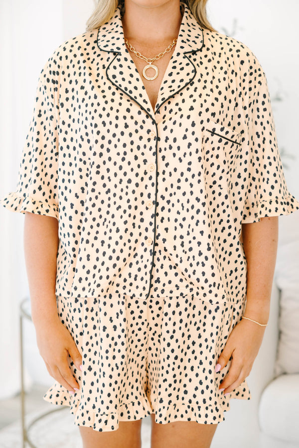 Plus Size cheetah print pajama set with short sleeves, black piping, and ruffled hem shorts.