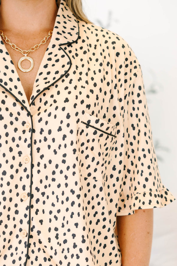 Plus Size cheetah print pajama set with short sleeves, black piping, and ruffled hem shorts.
