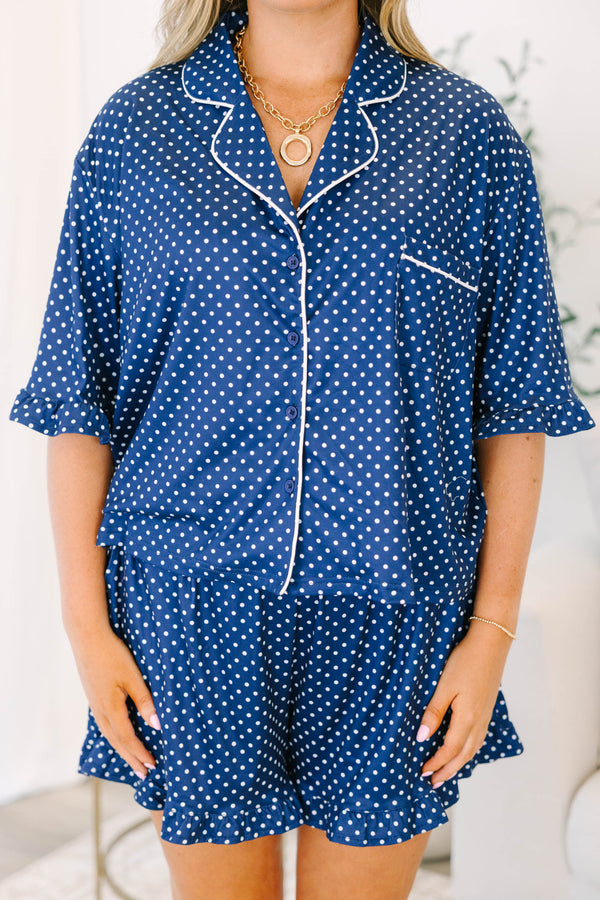 Plus Size light leopard print pajama set with a button-down short sleeve top and matching shorts.