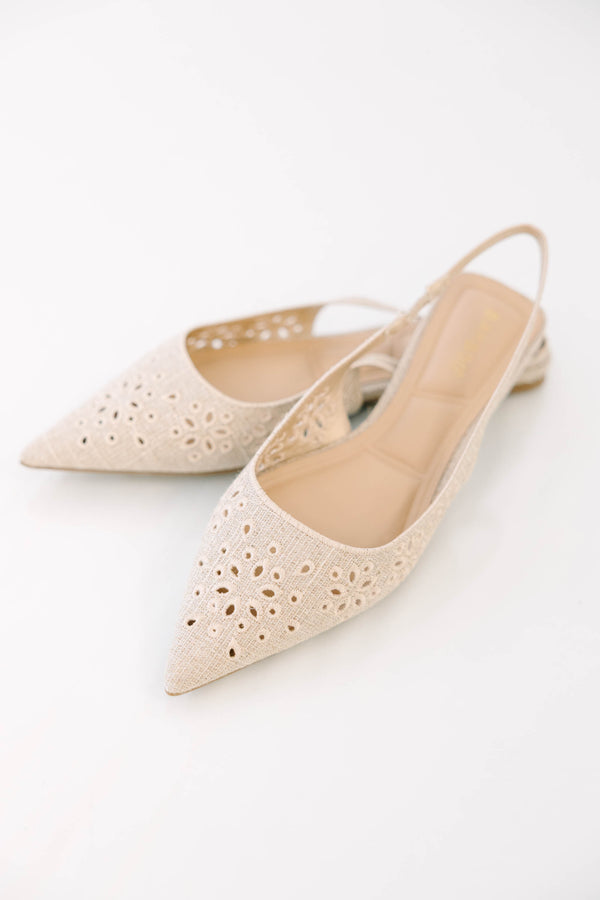 Natural pointed-toe slingback flats with delicate eyelet embroidery and a comfortable low heel.