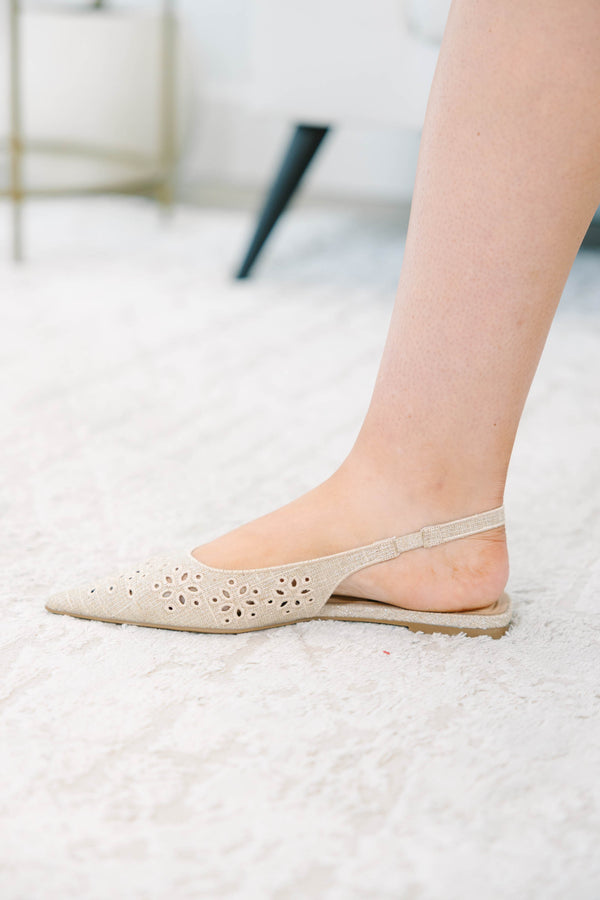 Natural pointed-toe slingback flats with delicate eyelet embroidery and a comfortable low heel.