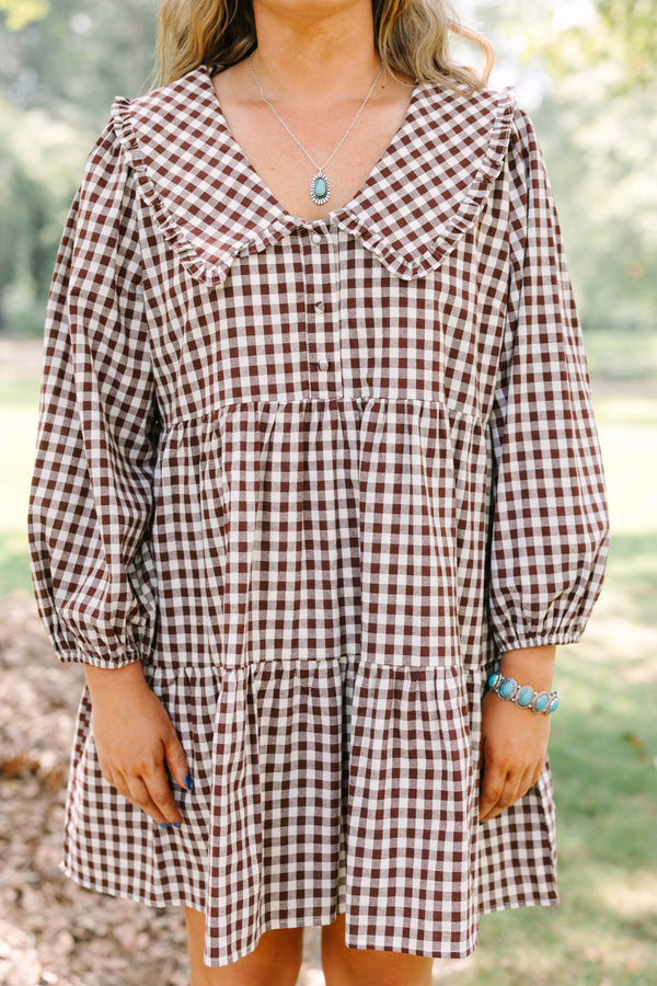 Plus Size brown gingham tiered dress with a wide collar, button front, and long puff sleeves.