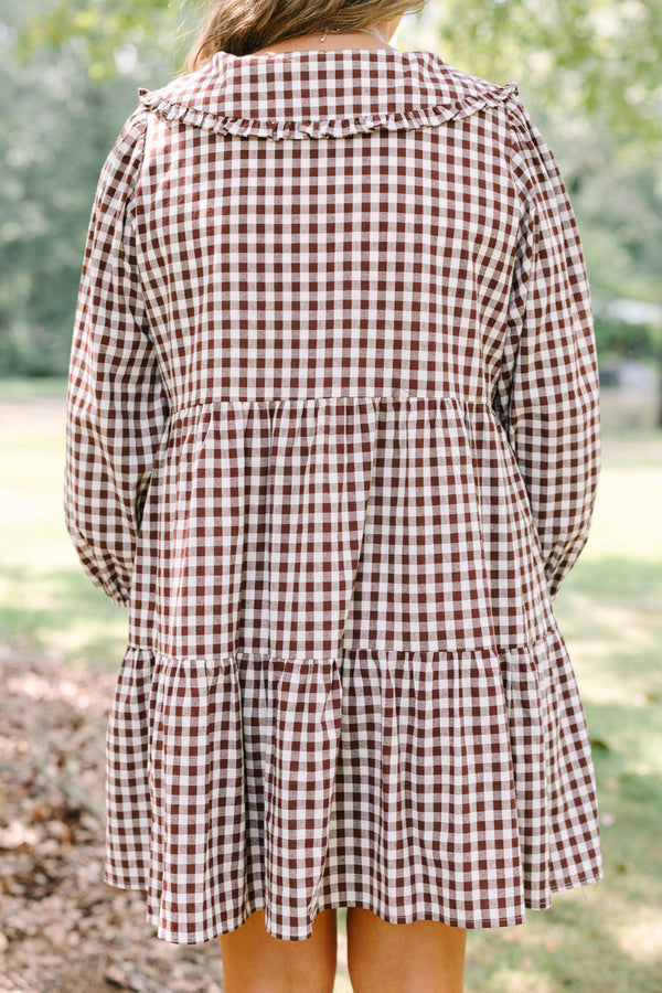 Plus Size brown gingham tiered dress with a wide collar, button front, and long puff sleeves.