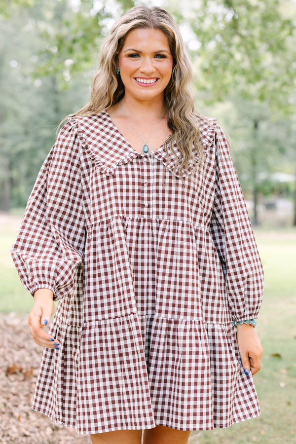 Plus Size brown gingham tiered dress with a wide collar, button front, and long puff sleeves.