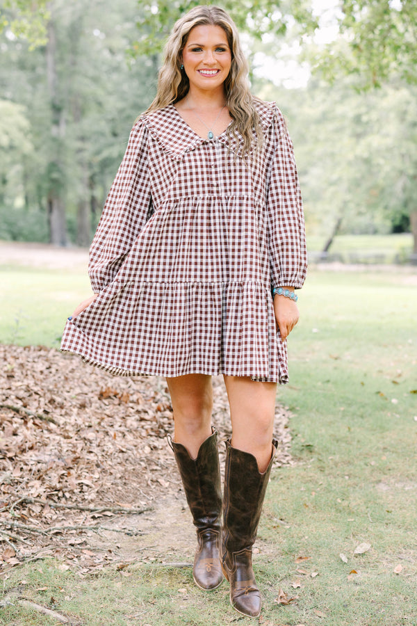 Plus Size brown gingham tiered dress with a wide collar, button front, and long puff sleeves.