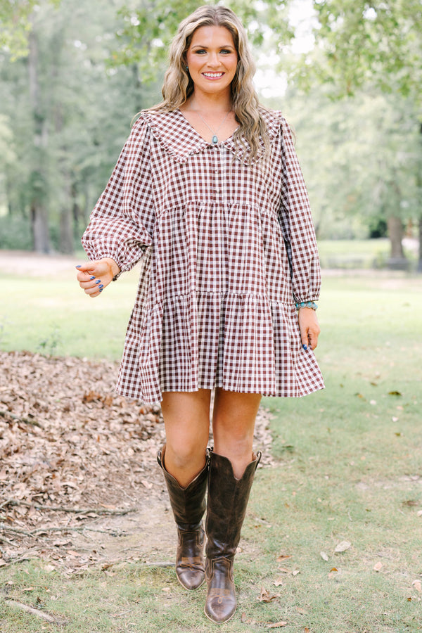 Plus Size brown gingham tiered dress with a wide collar, button front, and long puff sleeves.