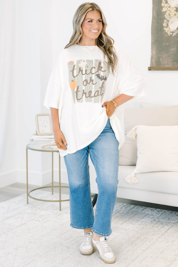 Plus size ivory boyfriend tee with a 'Trick or Treat' graphic, featuring a flowy, oversized fit.