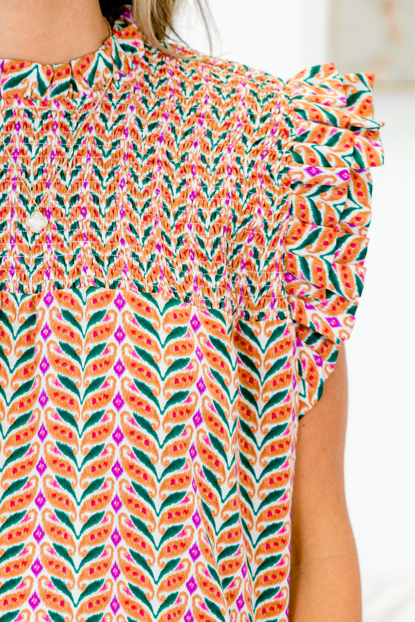Chic Soul plus size clothing, sleeveless rust orange top with smocked high neckline and geometric pattern with ruffled sleeves