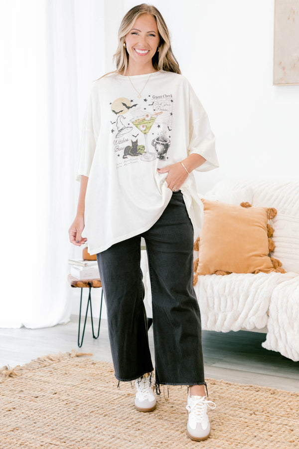 Chic Soul plus size clothing, ivory short sleeve boyfriend tee with a black cat, martini with eyeballs, bats, and other Halloween graphics on the front